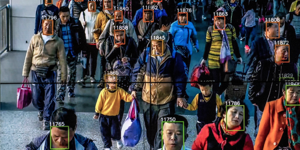 Image of Chinese people with green squares around their faces due to being captured on facial recognition software